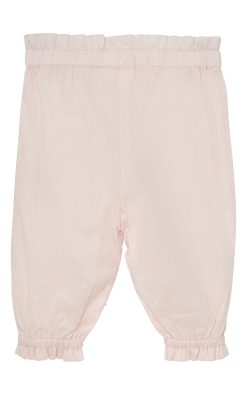 Einlitar lausar barnabuxur frá Fixoni SS26 í lit 5112 með teygju og pífukanti við ökkla